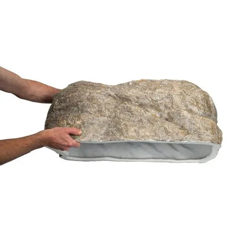 Natural-looking faux rock cover for outdoor electrical or pond equipment concealment.
