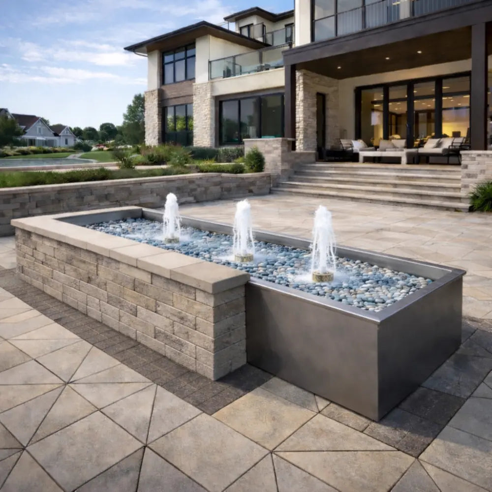 Outdoor water feature with modern house in the background