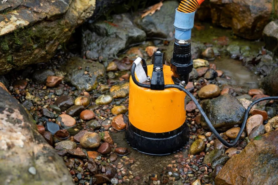 Aquascape LSR Cleanout Pump with a hose in the pond