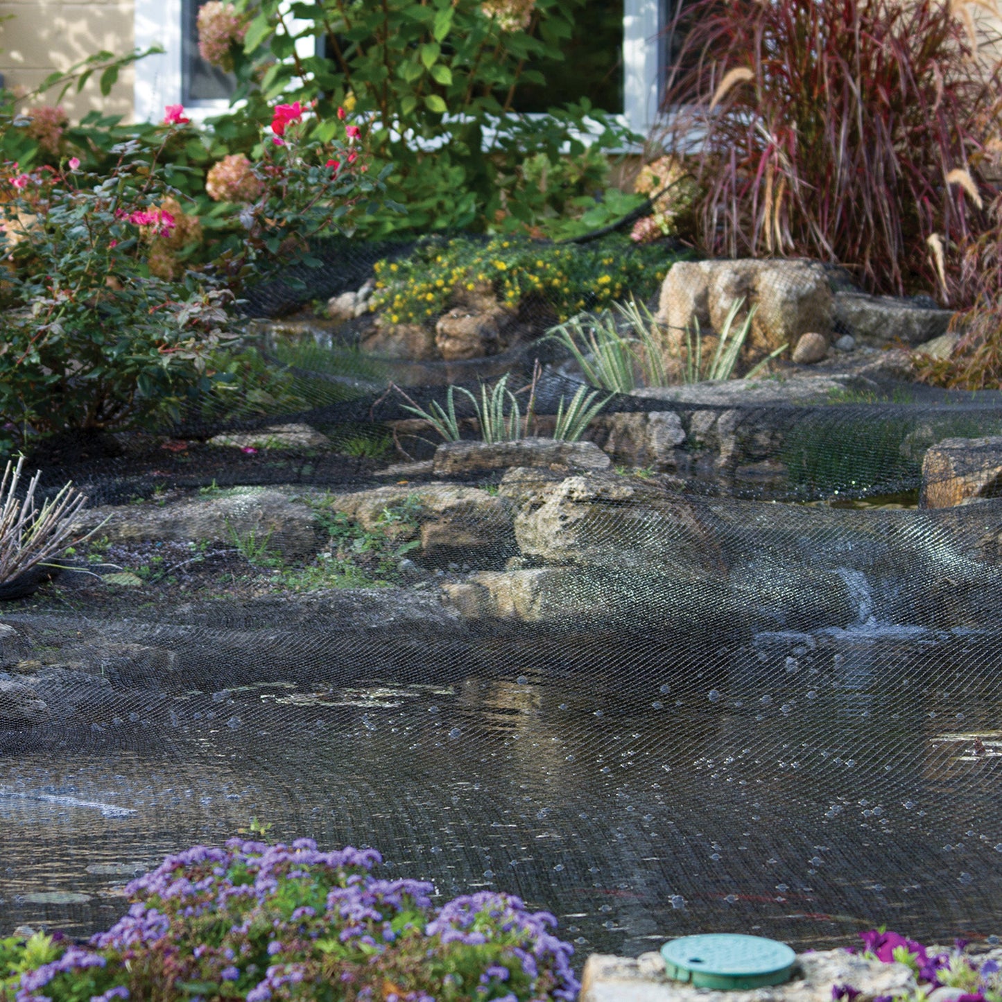 Atlantic-Oase Pond Netting installed over a landscaped pond