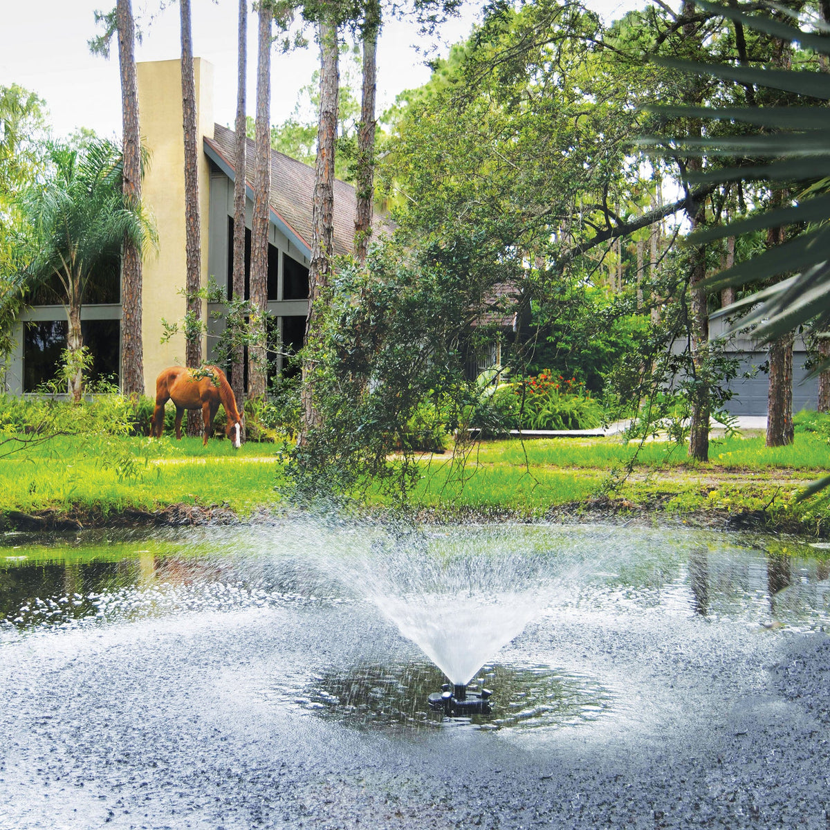 Atlantic-Oase 1/4 HP floating fountain operating in a pond