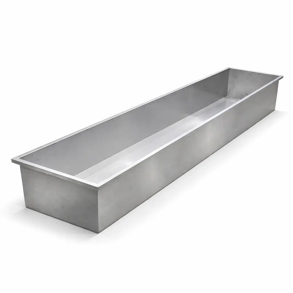 Stainless steel trough on a white background