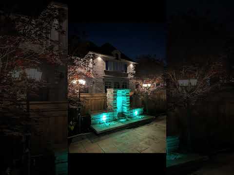 Two Spillway Fountain with color changing lighting at night in Brampton