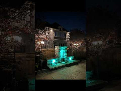 Two Spillway Fountain with color changing lighting at night in Brampton