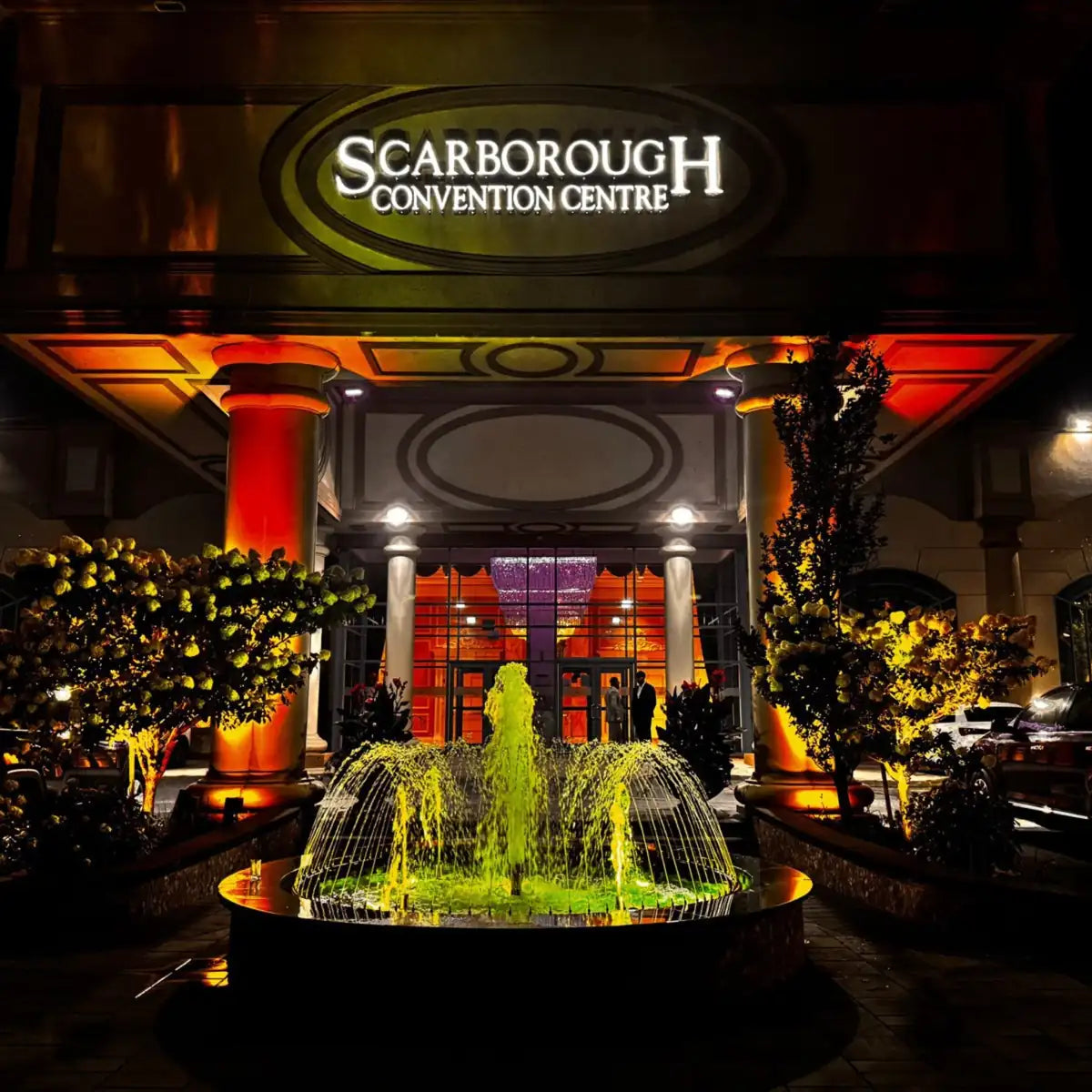 Entrance to the Scarborough Convention Centre with a fountain at night.